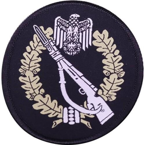 Vintage German military iron on patch with eagle and oak leaves design