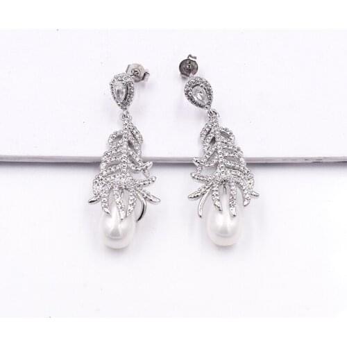 White Sea Shell Pearl Golden Plated Cz Pave Feather Earrings