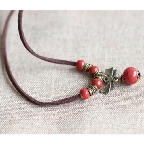Creative Handmade Ceramic Necklace Red Bead and Bowknot Pendant Sweater Leather Rope Bohemian Style Women Clothing Accessories
