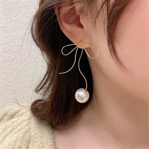 Super Fairy Hollow Metal Bow Pearl Earring Fashion Creative Retro Personality Earrings Cold Wind Earrings Tide Women Jewelry