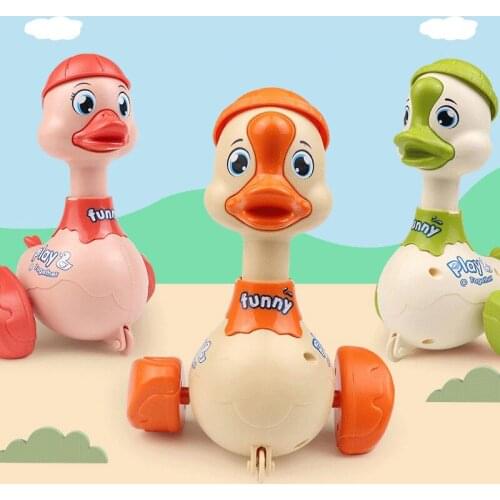 Child Cute Press Inertial Toys Funny Cartoon Duck Head 360° Turn Around Baby Kids Infant Crawling Gifts Shaking Ring Bells