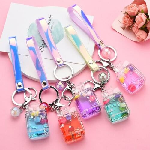 ZiccoWong New Design Liquid Oil Bow Perfume Bottle Keychain Keyring For Girl Kids Lovely Cartoon Mermaid Princess Keychain Gift