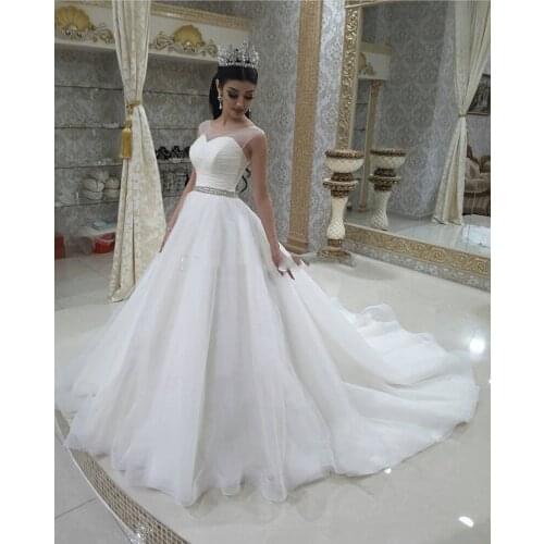 Charming Illusion A Line Wedding Dresses With Beaded Sash Corset Back Bridal Dress Sweep Train Sheer Neck Wedding Gowns