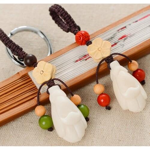 Creative bodhi root ivory fruit hand-woven magnolia primitive car keychain bag waist pendant jewelry