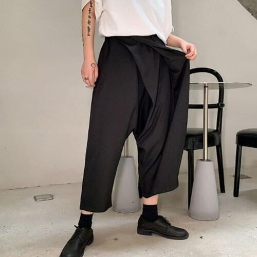 Homens estilo japão irregular plissado design solto casual preto harem calças masculino streetwear hip hop punk gótico calças sa