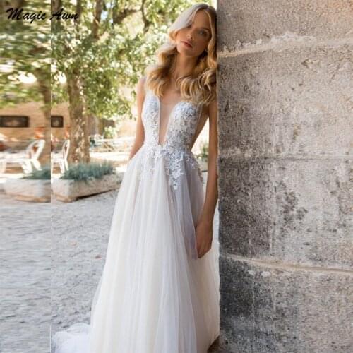 Magic Awn 2021 Bohemian Wedding Dresses Lace Appliques Illusion V-Neck Backless Beach Mariage Gowns A-Line Vestidos Branco
