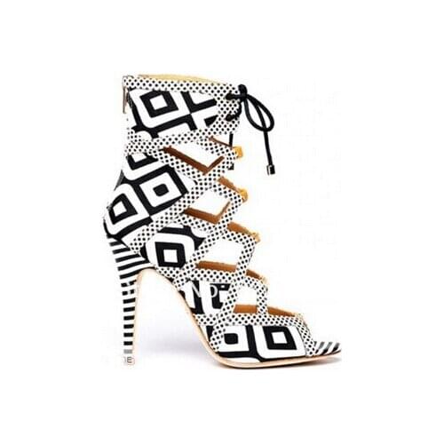 Fashionable geometric shaped black & white print featuring caged cut out design lace up with rear zipper gladiator sandals