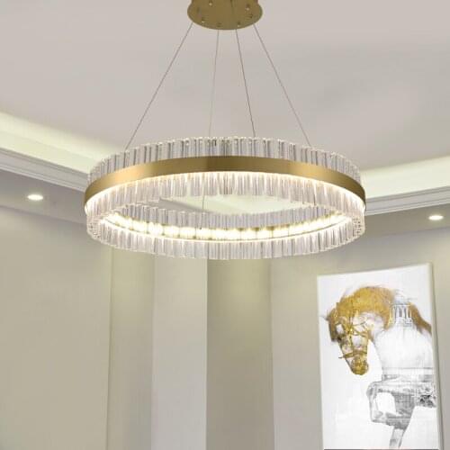Crystal chandelier in the living room of duplex building, modern light luxury villa, round three-color light fixture