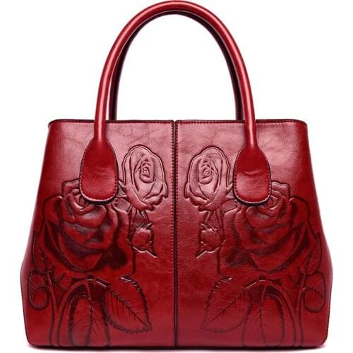 Embossed new fashion Chinese national style shoulder slung handbag stereo roses hand carved leather handbag
