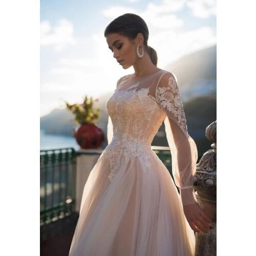 Amazing Champagne A Line Wedding Dresses with Long Puff Sleeves Sheer Scoop Lace Appliques Lace Up Buttons Bridal Gowns 2021