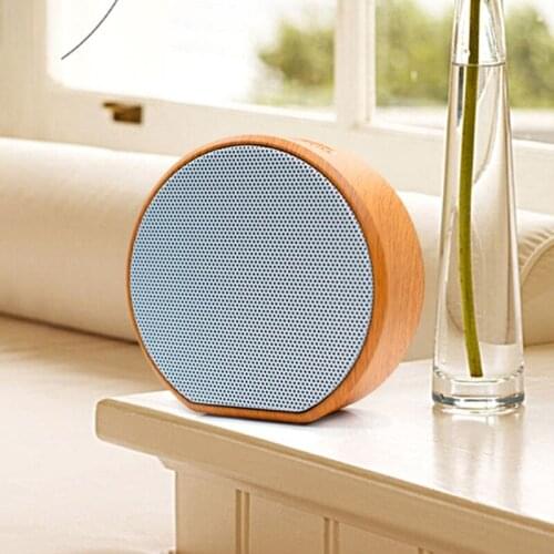 Portable Bluetooth-compatible 4.1 Speaker with Round Shape Button Operated Loudspeakers on Table with 600 mAh Battery
