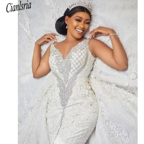 Luxury Crystals Arabic Dubai Wedding Dresses Aso Ebi V Neck Sleeveless Backless Beadings Lace With Detachable Train Bridal Gowns