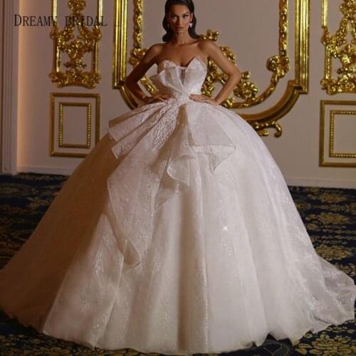 Dreamy Bridal Puffy Wedding Dresses Lace Beaded Sweetheart Peplum Ball Gown Floor Length Sleeveless Bridal Gowns