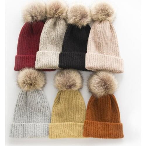 European and Korean autumn and winter warm womens knitted hat cashmere blend monochrome solid color all-match big fur ball