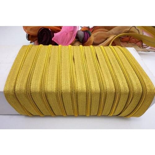 Bright gold zipper/5# 7# nylon zipper/shiny/whole bundle of zipper/50m and 100pcs head/golden sliders/for fashion bags shoes
