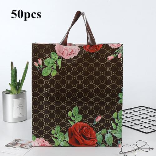 50pc / lot rose pattern Plastic Gift Bags Thick Portable Storage Shopping Bags Clothing store bags Wedding Party supplies