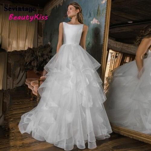 Sexy Satin Ruffles Tulle Wedding Dress A-Line Scoop Neck Bridal Gowns Sleeveless Sweep Train Backless Princess Bride Gowns 2021