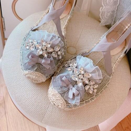 Summer new round-toe straw woven flat shoes Baotou pregnant women cross strap sandals lace leisure fisherman shoes women