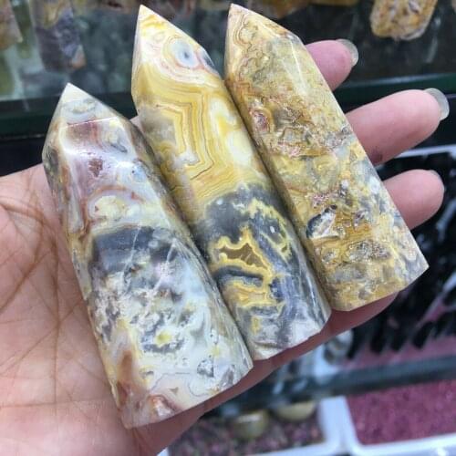 Anatural crazy agate obelisk with a quartz crystal wand point for Reiki healing