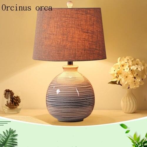 New Chinese classic cloth art desk lamp bedroom bedside lamp modern simple and creative manual ceramic table lamp free shipping