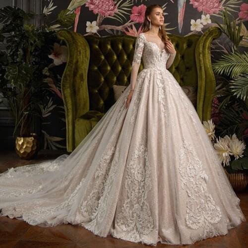 Luxury Wedding Dresses Long Sleeve O Neck Lace Applique Glamorous Gowns Shiny Tulle Pearl Robe de mariée Court Train Tailor-Made