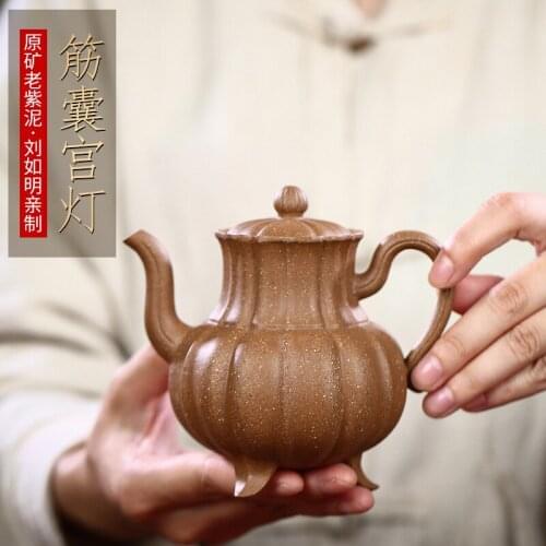 Wholesale Yixing famous purple clay pot pure hand-made raw ore colorful section mud tendon bag palace light bulb teapot
