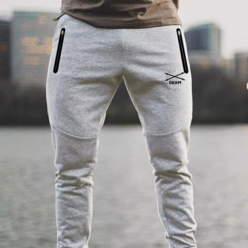 2020 European and American muscle sports mens cotton casual fitness zipper pocket sports casual pants embroidered trousers
