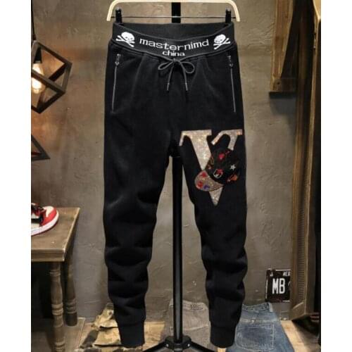New arrival Europe style new fashion brand mens casual hot drilling pants slim Leggings mens scalded skull head elastic pants