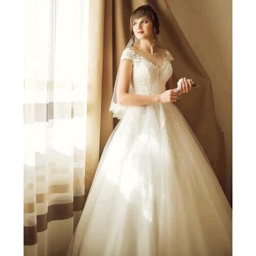 Wedding Dresses Ball Gowns O-Neck Lace Appliques Button Tulle Cap Sleeve Floor Length Gorgeous Bride Robe Custom Made New