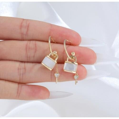 Korean temperament long shell key lock earrings spring new personality super fairy fashion cold wind earpiece female
