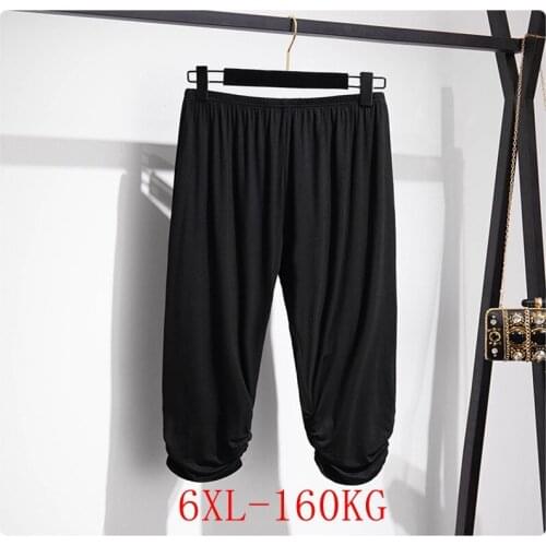 Large size womens leggings 2XL-6XL hip 170CM high elasticity loose solid color elastic foot bottoming cropped trousers