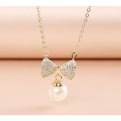 CHUNSHI Bow Tie Pearl Chain Pendant EMO Fashion Charm Delicate Shiny Delicate Bow Design And Womens Favorite Copper Necklace
