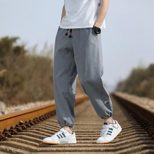 2021 spring new printed snowflake down sports pants mens loose Korean fashion casual drawstring Leggings