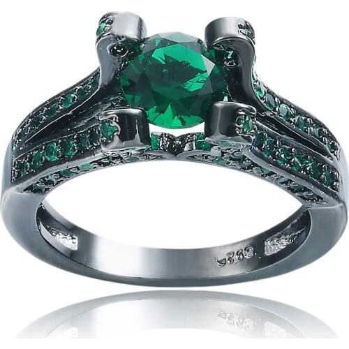 The black ring round green gem is noble and mysterious show the female individual glamour the wine party party generation