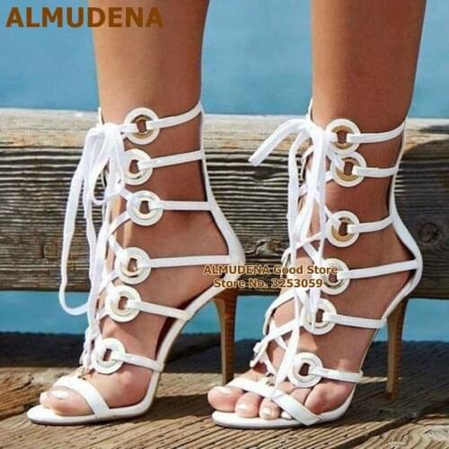 ALMUDENA Gold Metal Coin Embellished Sandals Stiletto Heels White Strappy Lace-up Dress Shoes Newest Women Cages Gladiator Pumps