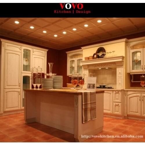 American oak wooden kitchen cupboard L shaped with island in centre