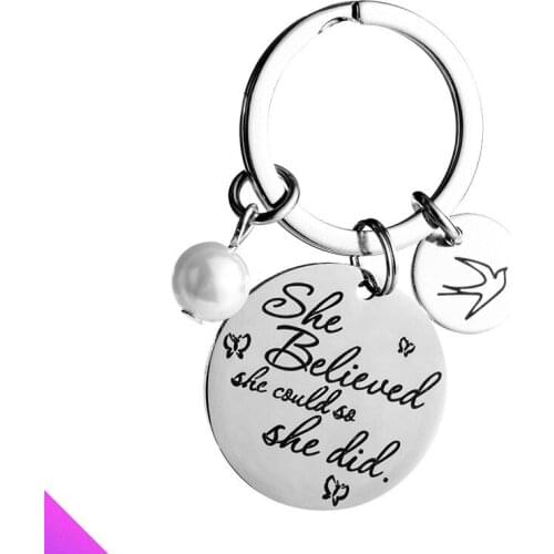 Keychain round stainless steel pendant with the words "She believed she could so she did"