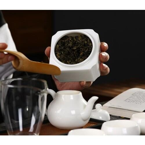 Tea cans, small ceramic storage jars, sealed bottles