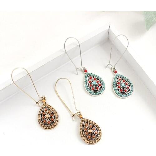 Two color earrings orange and blue with red and youthful young girl beads decorated to send friends accessories party