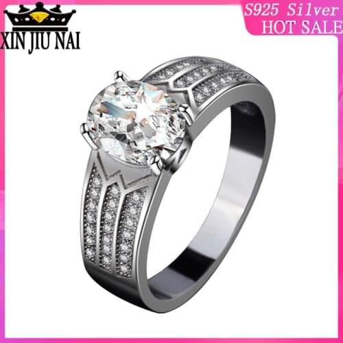 925 sterling silver Neutral retro pigeon egg-shaped stone inlaid with three rows of womens diamond ring refers tanzanite