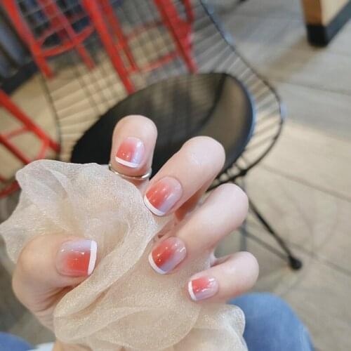 24Pcs Orange And White Blooming Fake Nails Glue Type Removable Short Paragraph Fashion Artificial Manicure Set Nail Art Tools