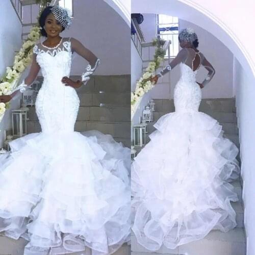 See Through African Mermaid Lace White Wedding Dresses Long Sleeves Open Back Tiered Skirts Nigerian Bridal Wedding Gowns