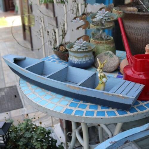 Shabby and chic retro wooden boat planter