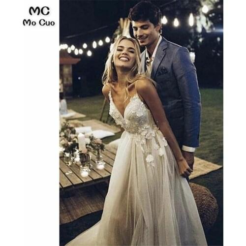 Puffy Tulle Wedding Dress With Deep V-neck Spaghetti Straps Open Back And Flowers And Lace Appliques Wedding Dress Bridal Gown