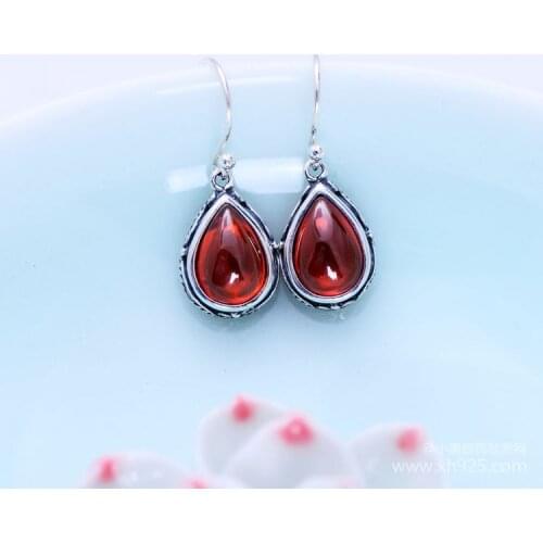KJJEAXCMY fine jewelry S925 Sterling silver inlay synthetic pomegranate stone female style earrings jewelry