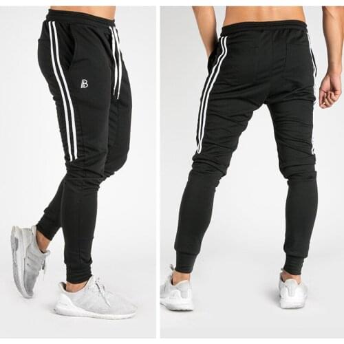 2021 new spring and autumn mens sports outdoor casual trousers fashion trend fitness feet pants squat running pants