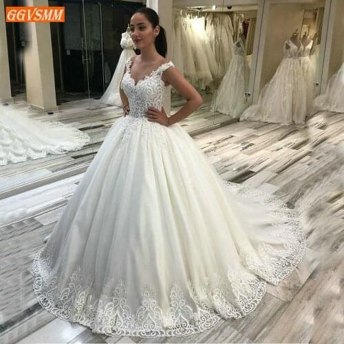 Sumptuous Arabic Ivory Wedding Gowns 2020 African Appliqued Beaded Lace Up Bride Dress Illusion Customized White Wedding Dresses