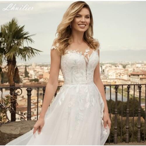 Lhuilier Cap Sleeves A Line Tulle Wedding Dresses 2021 Illusion Neck Floor Length Bridal Gowns Court Train with Lace Appliques
