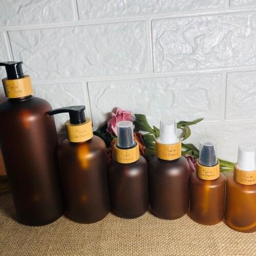 Wholesale Custom Amber Plastic PET Beauty Hair Tools Shampoo Hand Wash Lotion Bottles With Bamboo Pump Lid Cap