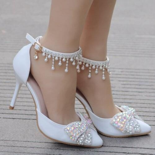 Crystal Queen Women Sandals Sexy White 9CM High Heels Shoes Bow Luxury Rhinestone Tassels Wedding Party Ankle Strap Shoes